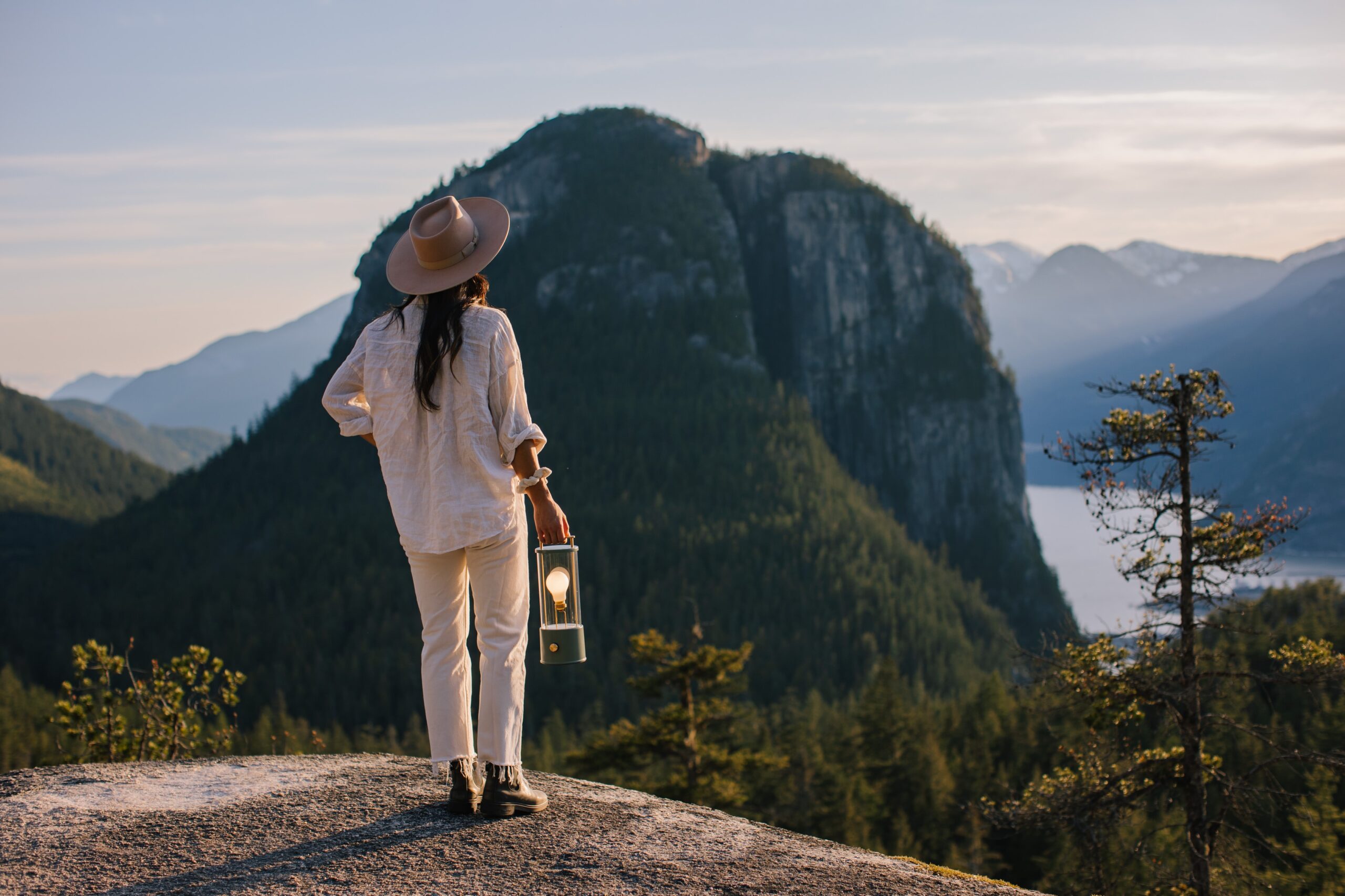 Woman standing on a mountain ridge in the Tala summer campaign